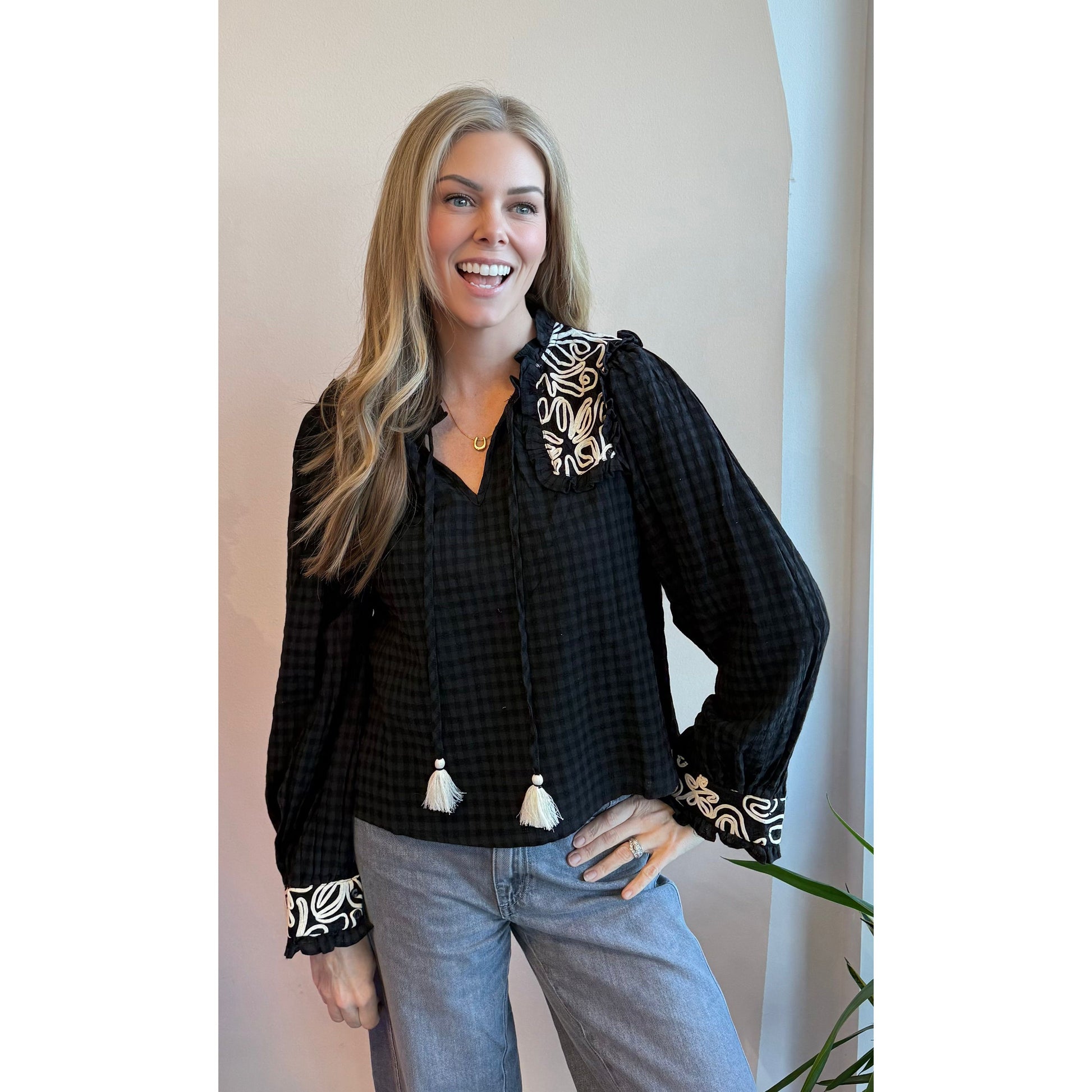 Gingham Puff Sleeve Top styled in black — puff sleeve top with jeans from Thread & Clover boutique