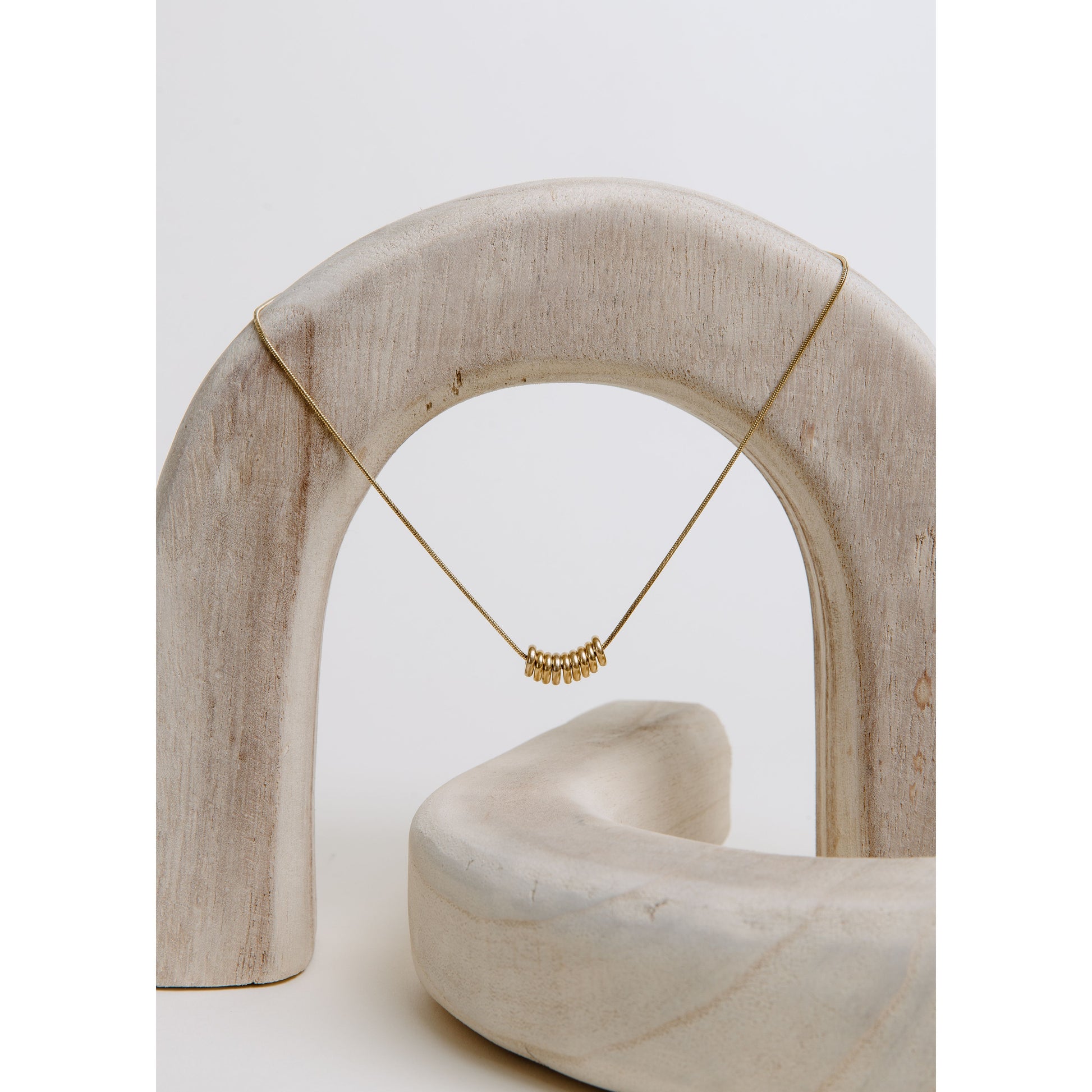 Gia Necklace in gold — petite looped charm necklace from Thread & Clover boutique