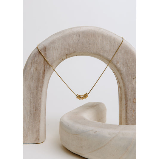 Gia Necklace in gold — petite looped charm necklace from Thread & Clover boutique