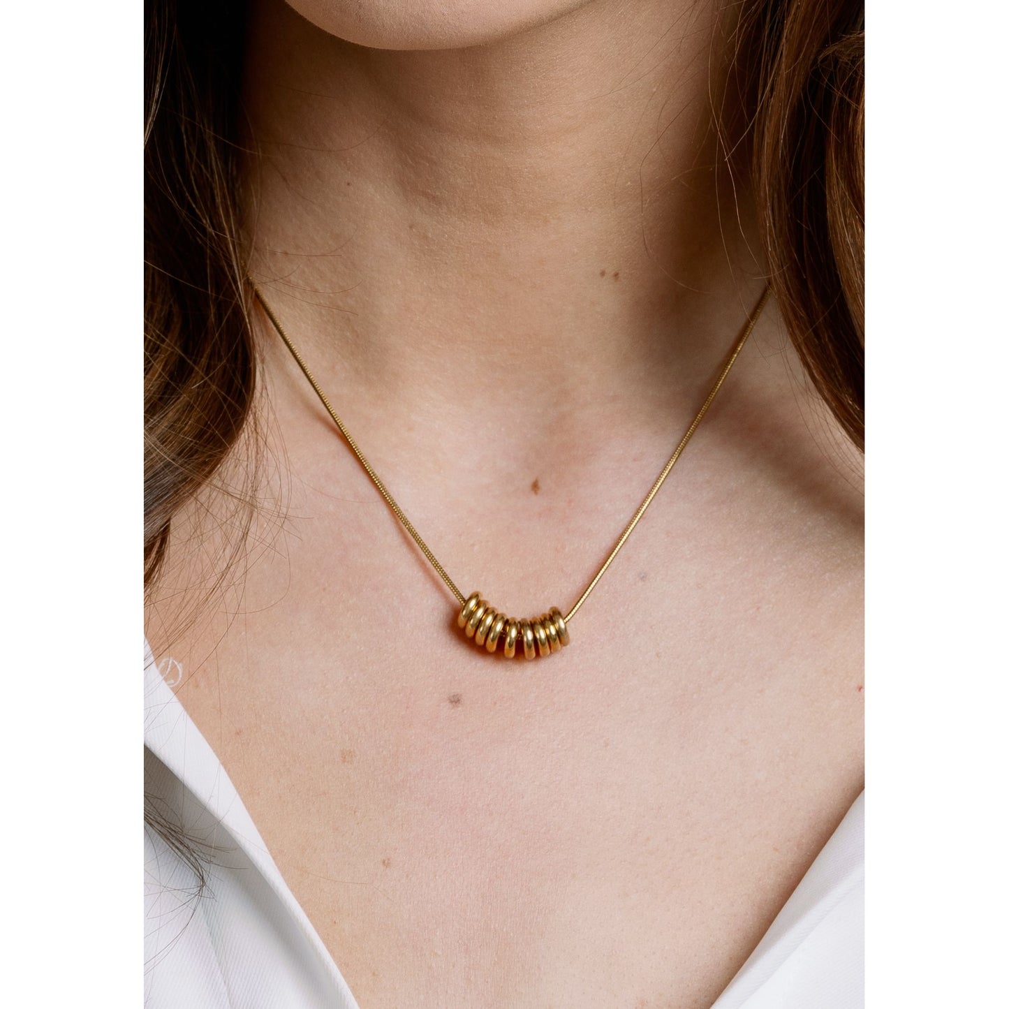 Gia Necklace close-up — gold looped charm detail from Thread & Clover boutique