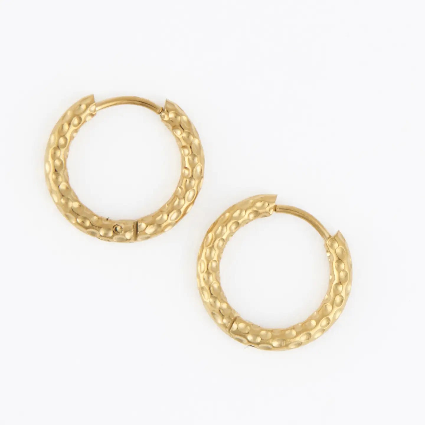 Waterproof Hammered Huggie gold worn on model — gold huggie hoop earrings from Thread & Clover boutique