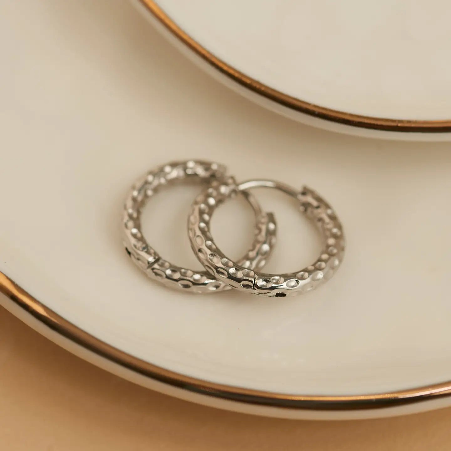 Waterproof Hammered Huggie in silver — hammered silver huggie hoop earrings from Thread & Clover boutique