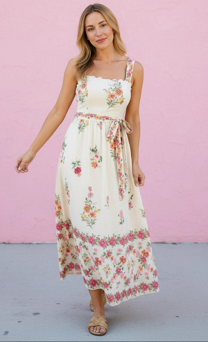 Woman wearing a floral dress against a pink background