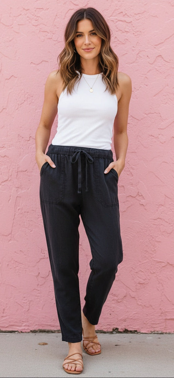 Lara Tencel Ankle Pant in washed black — front view showing drawstring elastic waist and patch pockets from Thread & Clover boutique